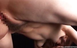 Lustful lady is grabbing her boobs while sucking a love stick